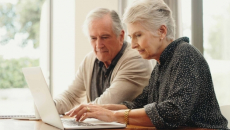 People using a laptop