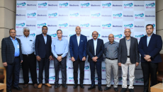 Zydus Hospitals and Medtronic officials pose for a photo during the signing of their stroke partnership