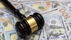 Gavel on pile of money