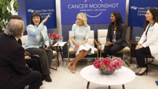 Dr. Monica Bertagnolli speaks as, from left, Dr. Alan Ashworth, Dr. Paola Bentancur, First Lady Dr. Jill Biden, medical student Kami Pullakhandam and Dr. Rita Mukhtar