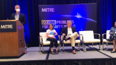 From left: Dave Hill of MITRE, Lorraine Wickiser of CMS and Pooja Babbrah of Point of Care, address post-acute care specialists during HIMSS23.