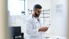 Doctor looking at smartphone