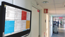 A hospital corridor monitor showing the Ascom Digistat