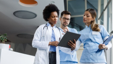 Healthcare workers looking at tablet