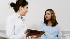 Doctor speaks with patient