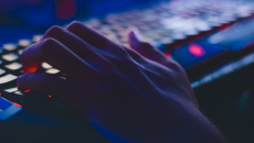 Hacker hand on keyboard