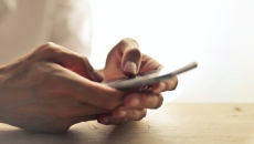 Hands holding smartphone