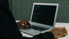 A hacker using a laptop