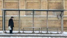 Person at bus shelter in winter
