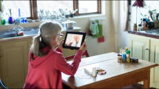 Person attending telehealth appointment on a tablet