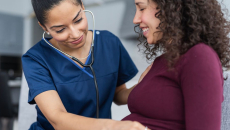 Healthcare provider helping a patient