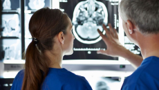 Healthcare workers looking at an X-ray