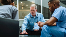 Hospital staff in discussion among themselves