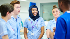 Medical students discussing with their manager