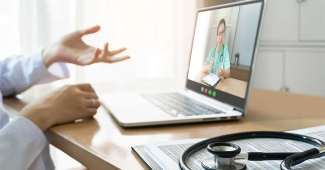 clinician hands and laptop open to a telehealth call