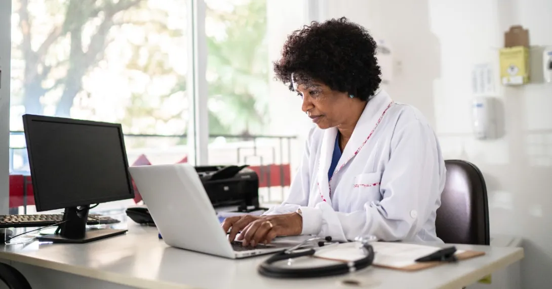 Health professional at computer