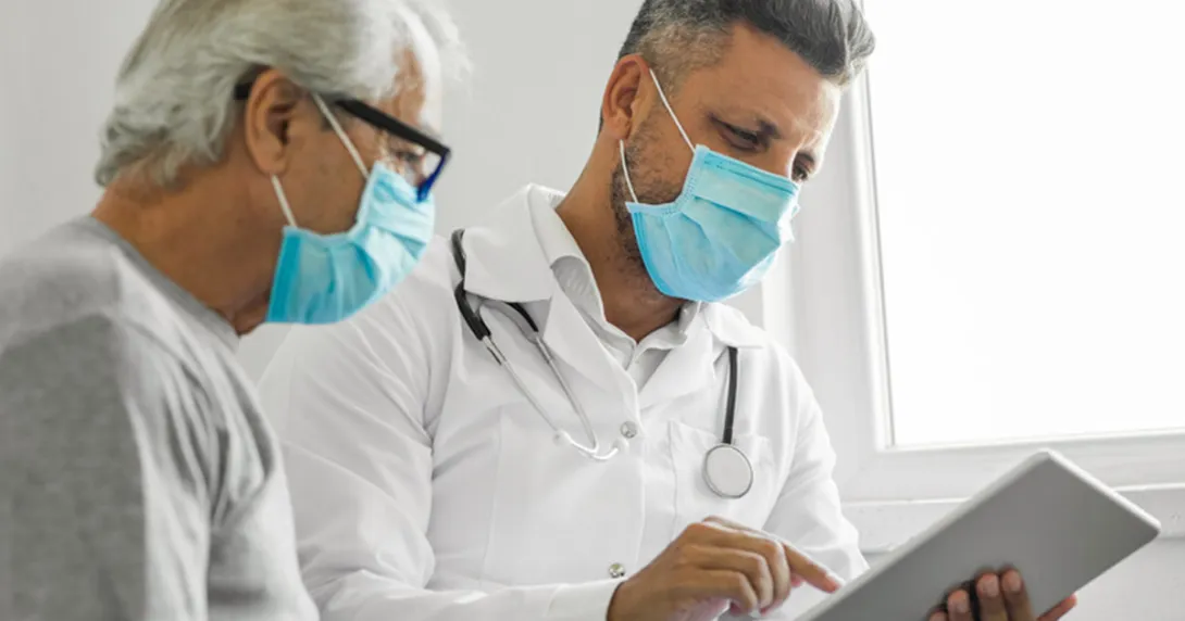 A medical consultation in person with a tablet