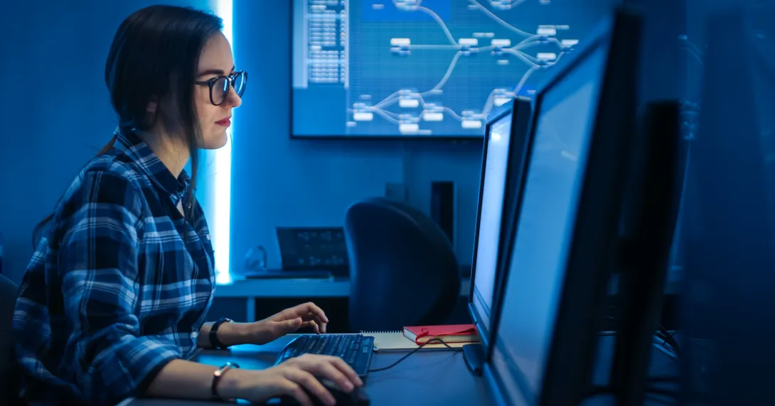 A programmer doing codes in a desktop computer