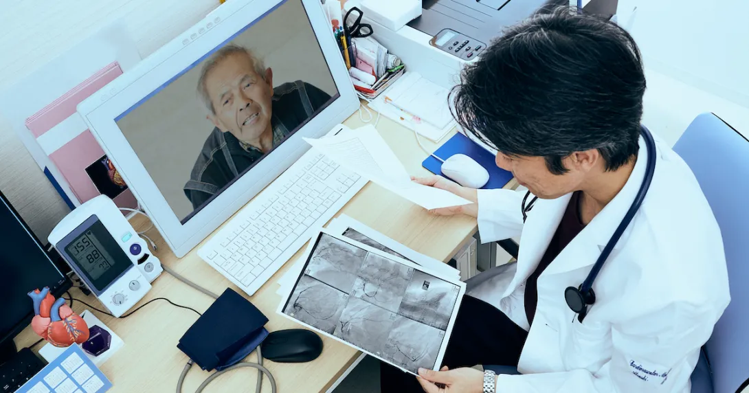A doctor discussing a patient's X-ray via video call