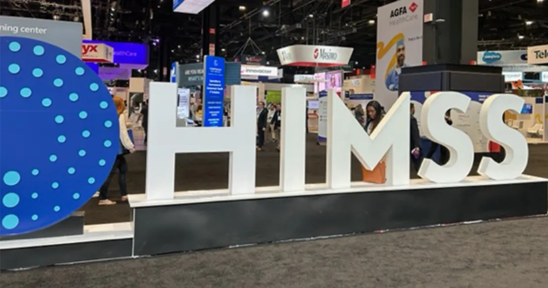 HIMSS Global Health Conference and Exhibition sign and floor exhibits