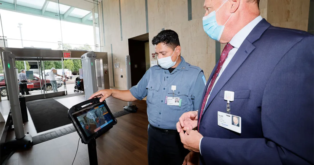 People look at a security screen