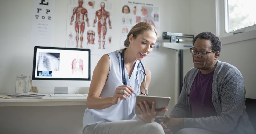 Doctor speaking to patient