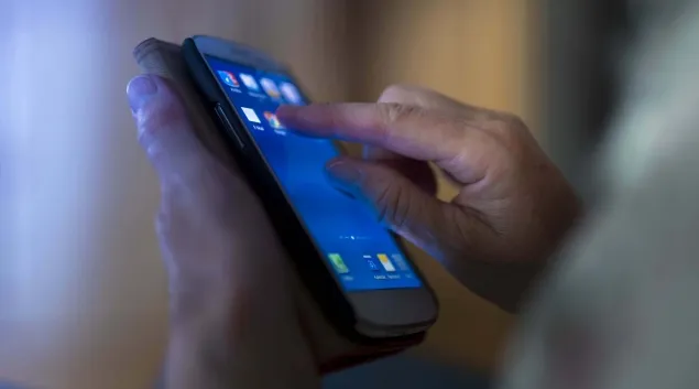 Hands on a smartphone