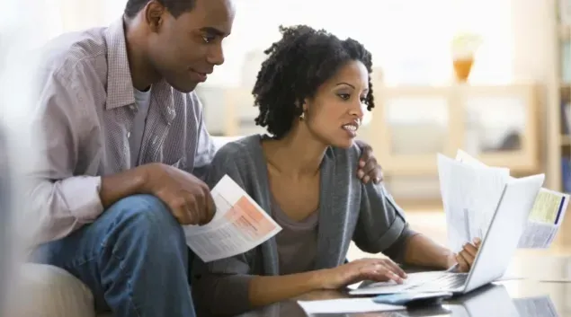 Couple looks at medical bills
