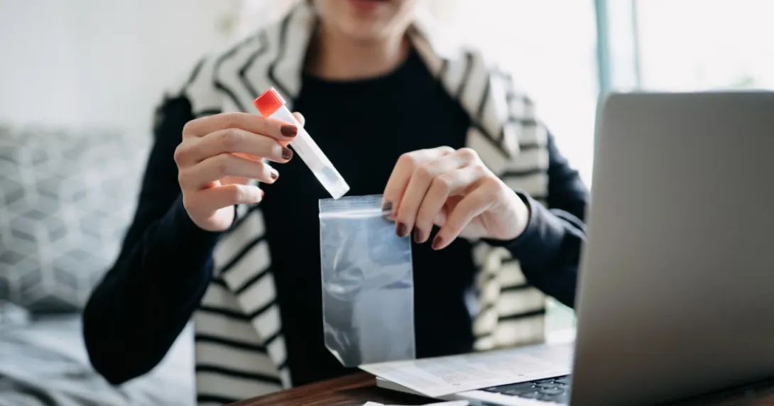 A person taking a COVID-19 self test