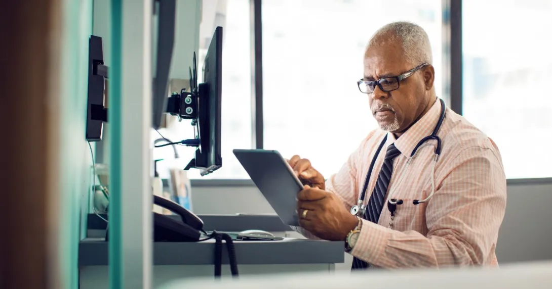 Doctor using EHR tablet