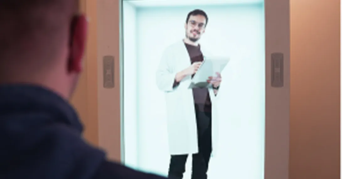Male doctor appears in a 3D hologram display with a patient in the foreground