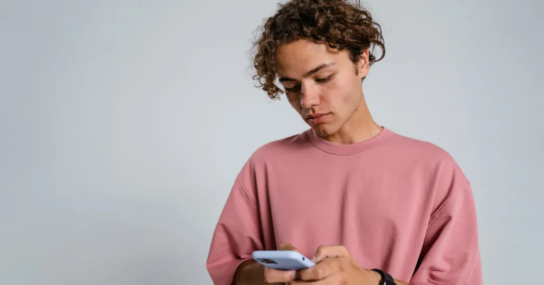 A person on their iPhone