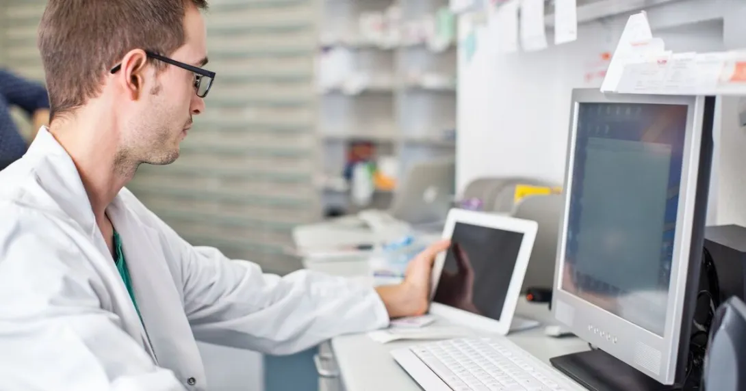 A doctor using a desktop computer
