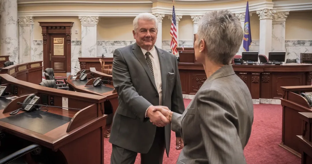 Politicians shaking hands in legislative chamber Politicians shaking hands in legislative chamber