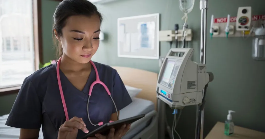 A doctor using a tablet computer