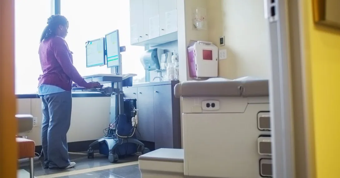 A nurse accessing records in a computer