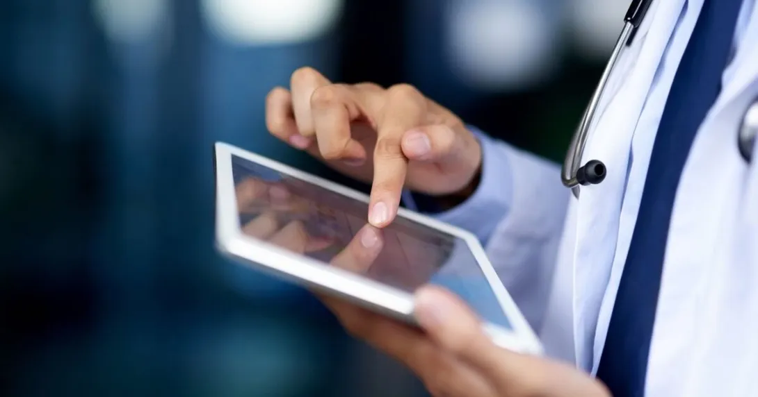A doctor using a tablet computer