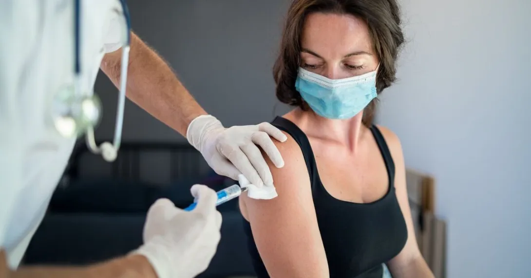 A person getting their COVID-19 vaccine shot