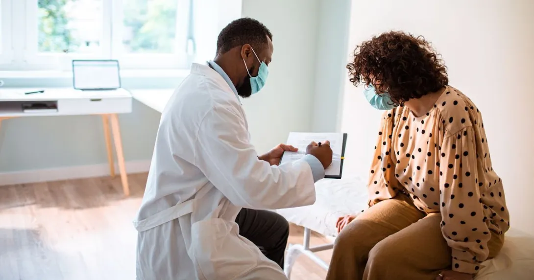 Patient speaks with her doctor about treatment plan