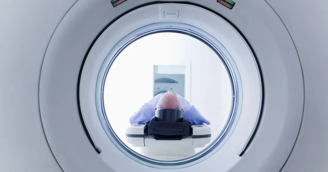 A patient undergoing CT scanning