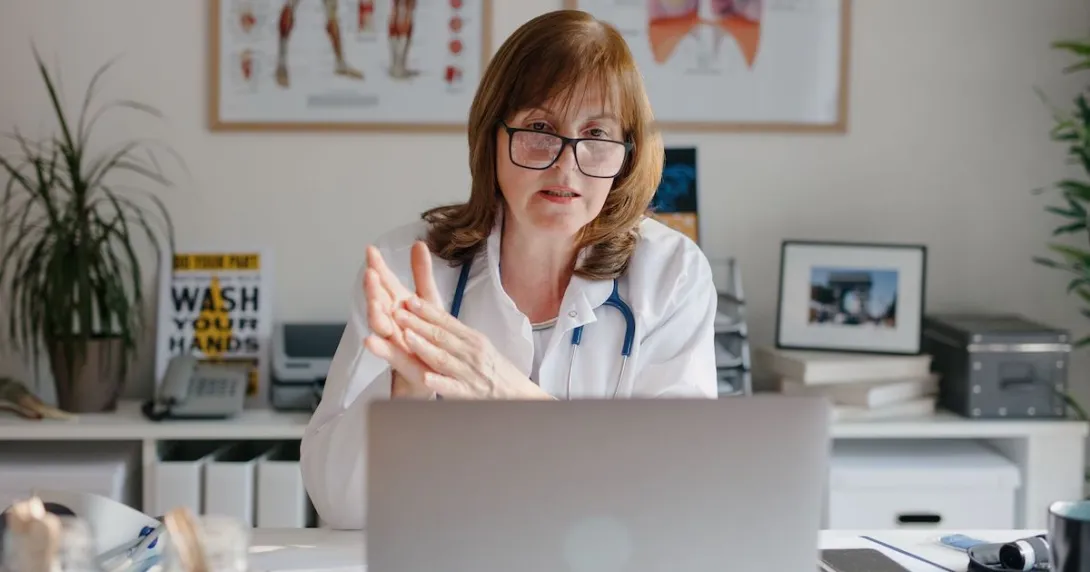 A doctor on a virtual consultation using a laptop computer 