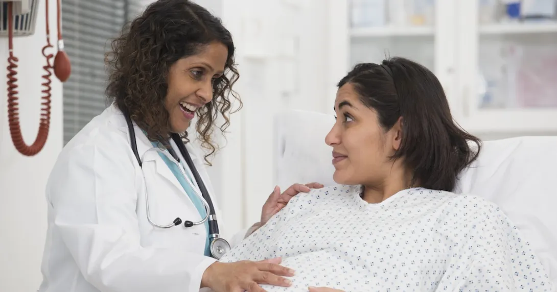 A doctor checking up on a pregnant patient