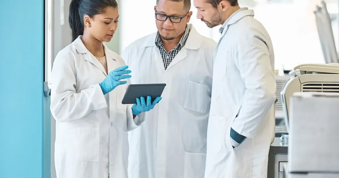 Doctors review information on a tablet