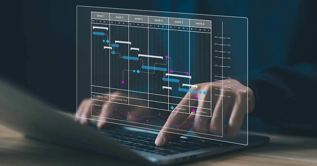 Data table display projected over hands on laptop keyboard