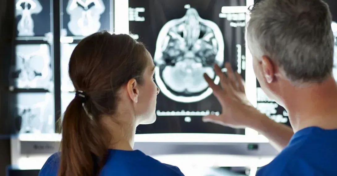 Doctors look at brain imaging on a monitor