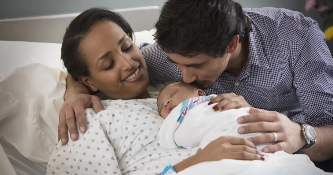 Parents holding a baby