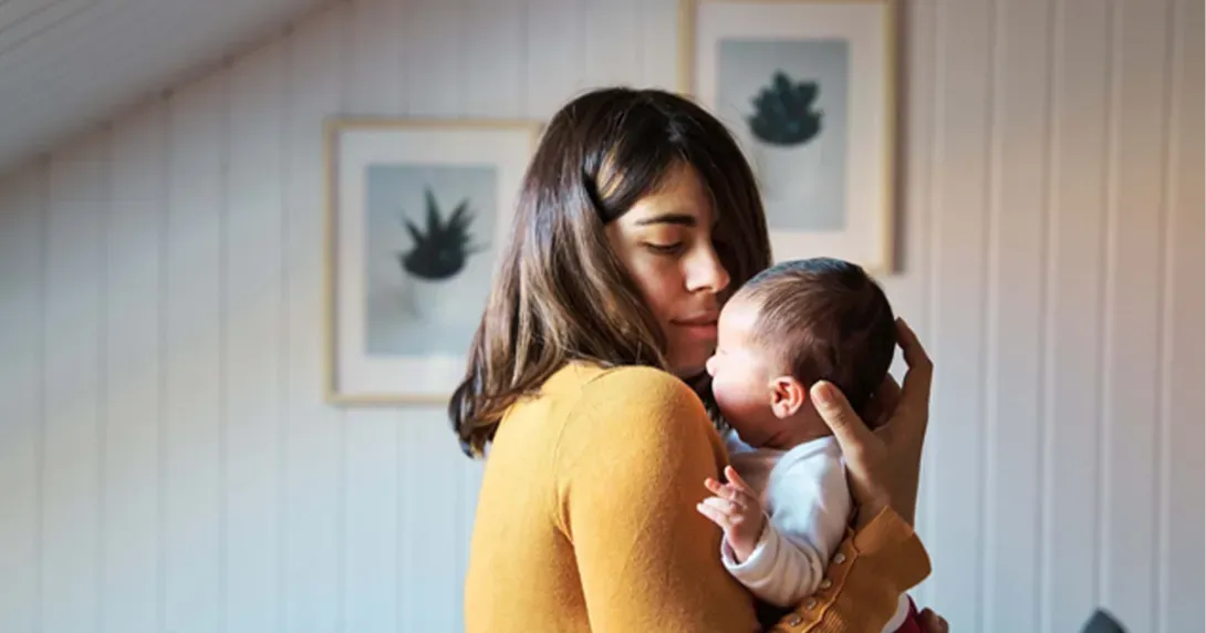 Mother holds baby