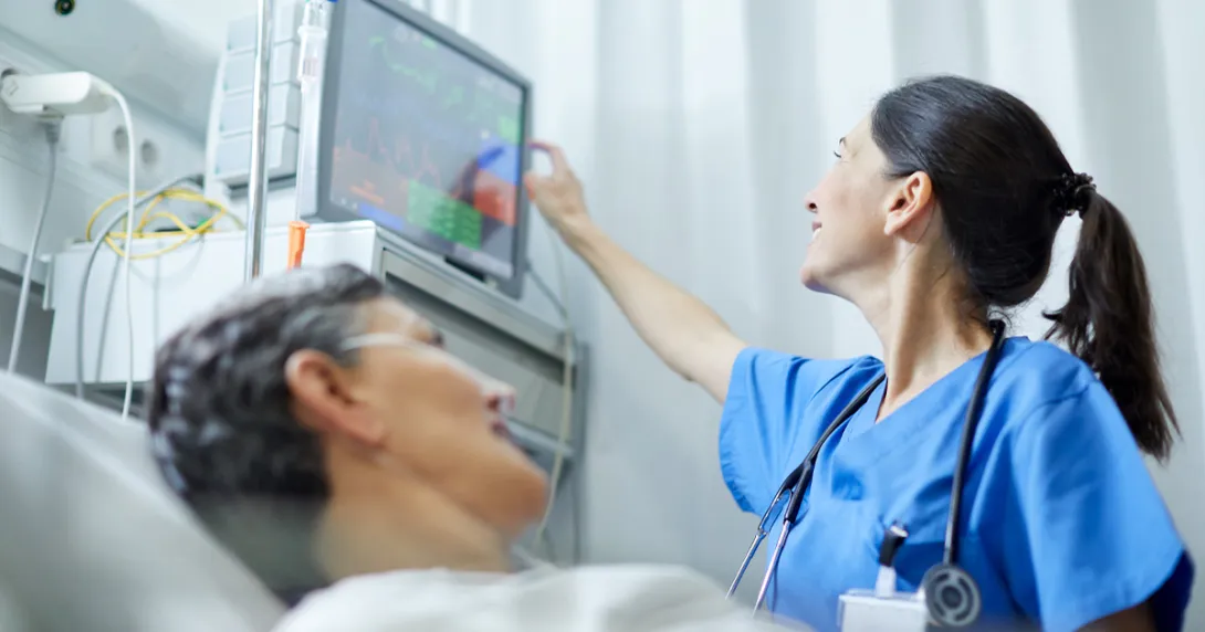 Healthcare worker checking patient's vitals