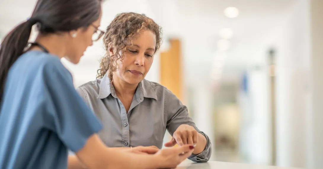 A n in-person health visit with a smartphone