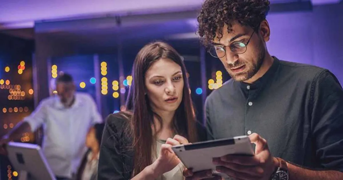 People looking at a tablet